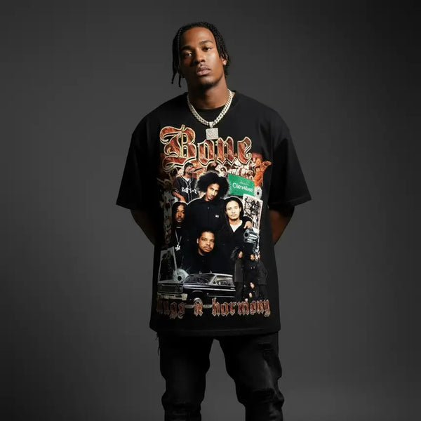 Person wearing a black t-shirt with graphic design and text on a dark background